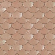 a close up view of the scales of a fish scale pattern on a pink background