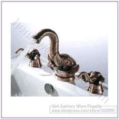 the faucet is shaped like an elephant