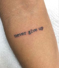 a tattoo saying never give up on someone's arm with the word written in black ink