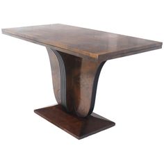 a wooden table with an unusual design on the top and bottom, against a white background