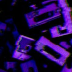 an abstract image of cassettes stacked on top of each other in blue and purple