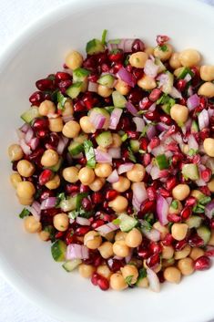 a white bowl filled with lots of food