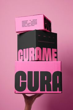 Curame is a high-quality hair care brand dedicated to restoring and  revitalizing all hair types. With a vibrant and youthful aesthetic characterized by bold pink and black colors, Curame offers a range of nourishing shampoos, oils, hair masks, and many more. The products are designed to repair damage, promote growth, and enhance shine and softness, all while maintaining a clean, sleek, and fun image. Black And Pink Packaging Design, Pink And Black Packaging, Inside Packaging Ideas, Branding And Packaging Design, Hair Wax Packaging Design, Hot Pink Graphic Design, Pink Black Branding, Bold Product Design, Edgy Packaging Design