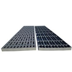 two large metal grates sitting on top of each other