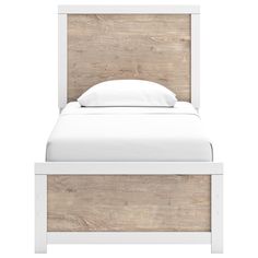 a white bed with a wooden headboard and foot board on it's side