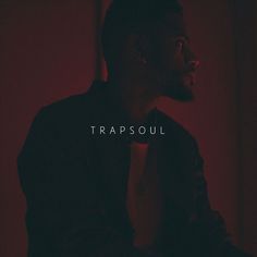 a man in a dark room with the words trapsoul over his left shoulder