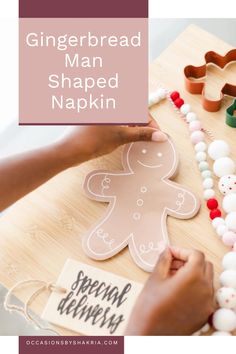 gingerbread man shaped paper napkin on a table with beads and other crafting supplies