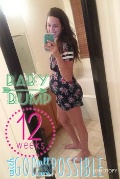 a woman taking a selfie in front of a mirror with the words baby bump on it