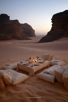 a table set up in the desert for dinner