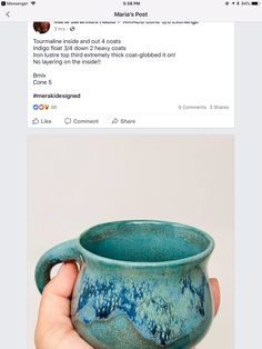 a hand holding a blue ceramic cup in front of a facebook post