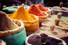 many bags filled with different colored powders