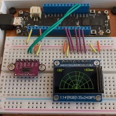 the electronic board has many wires attached to it and is connected to an ardu