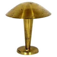 an antique brass table lamp on a white background