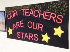 a sign that says our teachers are our stars hanging on the wall next to two pictures