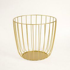 a gold wire basket on a white background, with the bottom section partially open to show it's inner surface