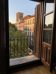 an open window with a view of the city