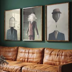 three paintings hang on the wall above a leather couch in a green room with a brown sofa