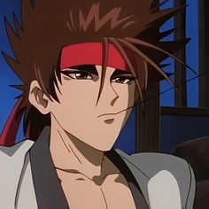 an anime character with black hair and red bandanna on his head looking at the camera