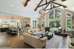 a living room filled with furniture and windows