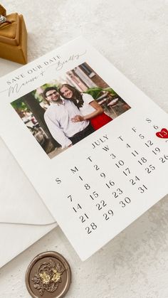 a calendar with a photo on it next to a wax stamp