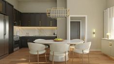 a white table and chairs in a room with wood flooring, cabinets and an oven