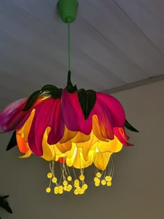 a chandelier hanging from the ceiling in a room