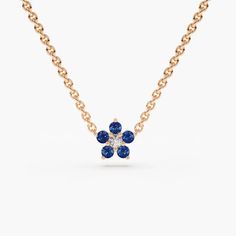 Sapphire and Diamond Flower Char Necklace Details	Made to Order.	Gold Kt: 14K Solid Gold	Custom Gold Color: Rose Gold, Yellow Gold, White Gold	Round Sapphire: 5 pcs pc 1.75 MM	Round Diamond: 1 pcs 2.00 MM	Total Sapphire CTW: 0.12 Ctw	Total CTW: 0.04 Ctw	Diamond Color-Clarity: G Color Si1 Clarity	Setting Type: Prong	Length& Width: 5.75 X 5.75MM Shipping Time 10-12 Working Days Flower Charm Necklace, Blue Sapphire Pendant, Round Sapphire, Necklace Flower, Charm Chain, Jewelry Elegant, Dope Jewelry, Sapphire Pendant, Timeless Luxury