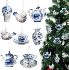 a christmas tree decorated with blue and white porcelain ornaments, hanging from strings on hooks