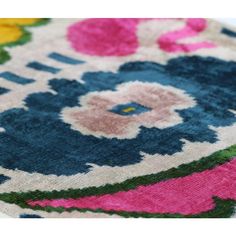 a colorful rug with flowers on it