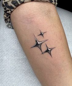 three stars tattoo on the leg