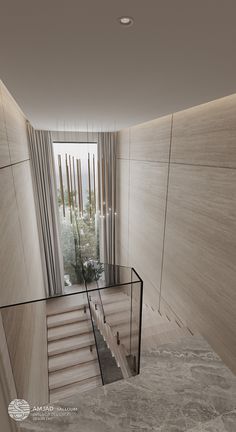 the stairs lead up to the second floor in this modern house with glass railings