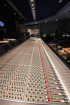 an audio mixing console in a recording studio