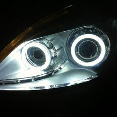 the headlight of a car with its lights turned on