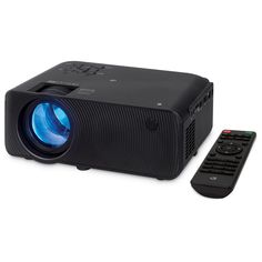 a black projector sitting next to a remote on a white surface with a blue light in the center