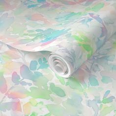 an abstract floral wallpaper with pastel colors and white paper rolled up on it