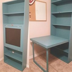 there is a desk and bookcase in the room