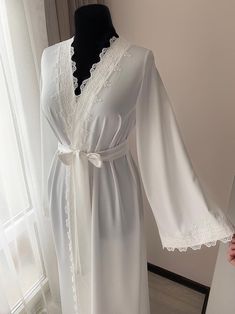 Long bridal robe with lace Ivory robe morning lingerie | Etsy Feminine Lace Wedding Robe, White Lace Nightgown For Wedding, Elegant Lace Bride's Robe, Elegant Lace Bridal Robe, Feminine Wedding Gown With Lace Trim, White Lace Wedding Nightgown, Elegant Delicate Lace Robe For Wedding Night, Elegant Wedding Night Robe With Delicate Lace, Elegant Lace Nightgown