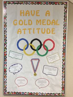 a bulletin board that says have a gold medal attude with olympic symbols and speech bubbles