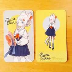 two coasters with cartoon characters on them sitting on a wooden table next to each other