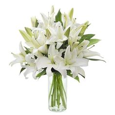 a vase filled with white flowers on top of a table