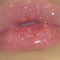 the lip is covered with glitter and has pink lips