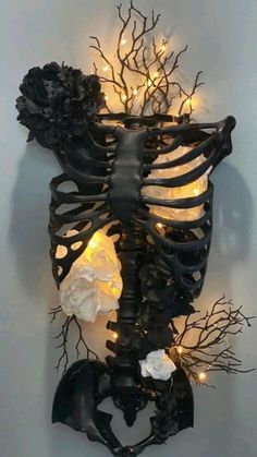 the skeleton is decorated with lights and flowers