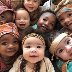 a group of young children standing next to each other wearing headscarves and scarves