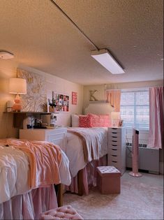 a bedroom with two twin beds and pink curtains