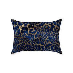 a blue and brown pillow with an animal print pattern on the front, sitting on a white background