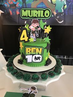 the cake is decorated with green frosting and features an image of a cartoon character