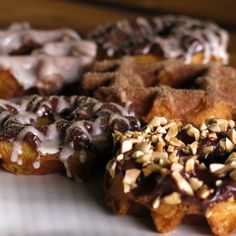 there are many donuts with different toppings on them