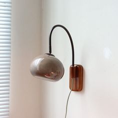 a lamp that is on the side of a wall