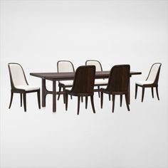 an image of a dining room table and chairs with white upholstered backrests