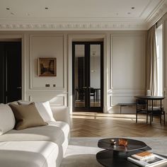 a living room filled with furniture and white walls